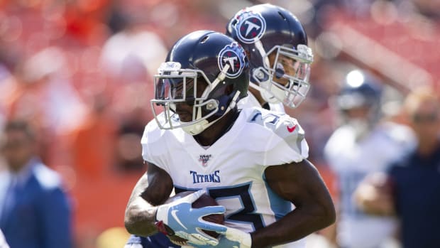 Tennessee Titans running back Dion Lewis (33) runs the ball during warmups before a game against the Cleveland Browns at FirstEnergy Stadium.
